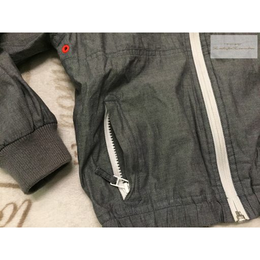 Next 7 év 122 cm  szürke - narancssárga szél és vízálló fiú átmeneti kabát/ széldzseki - újszerű, hibátlan