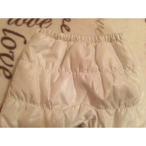 George újszülöttre való 50 - 56 cm, 4,1  kg  fehér csillogós pufi jellegű vastagon bélelt  overall nadrág 